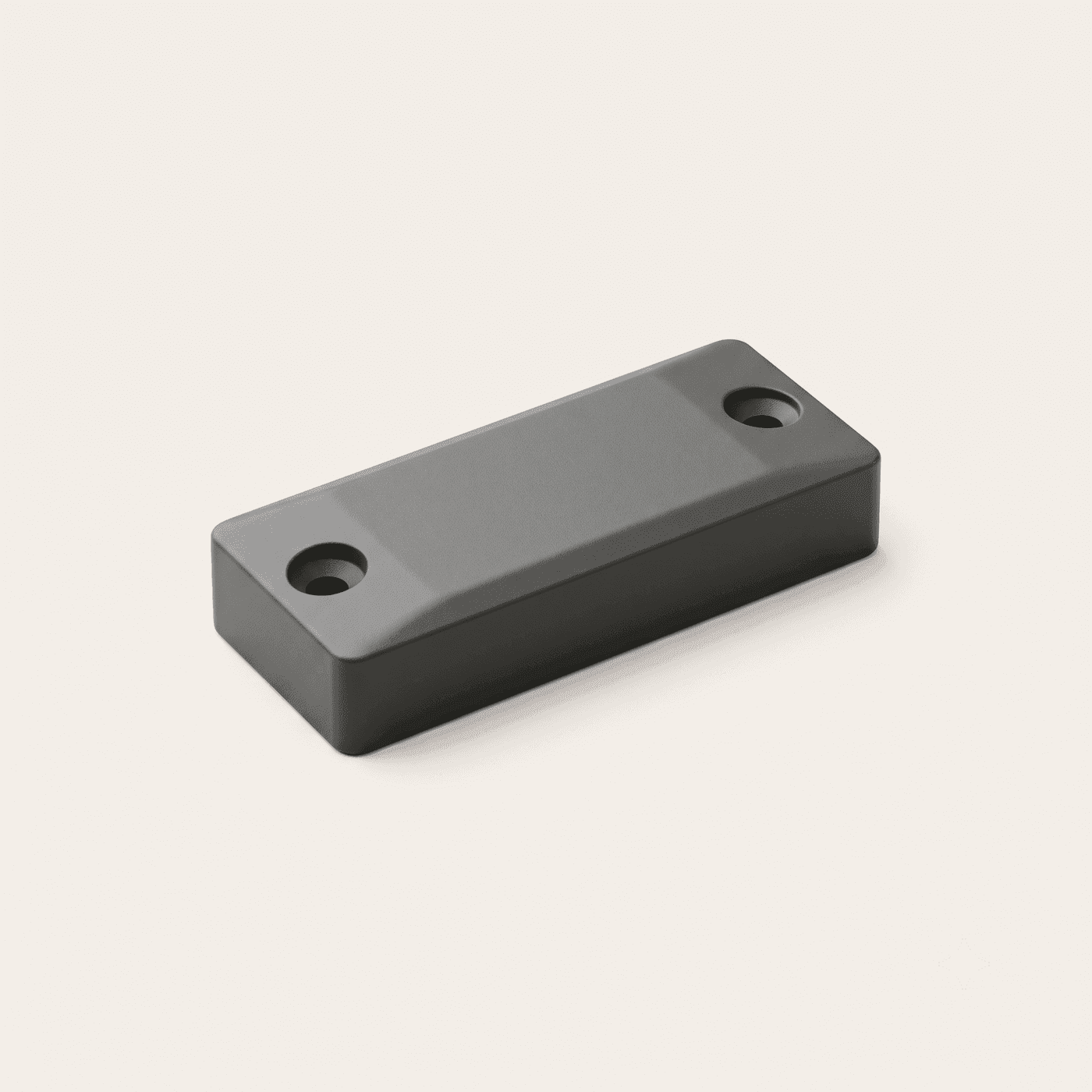 Rugged on-metal RFID tag — a hard polymer block with countersunk screw holes at either end