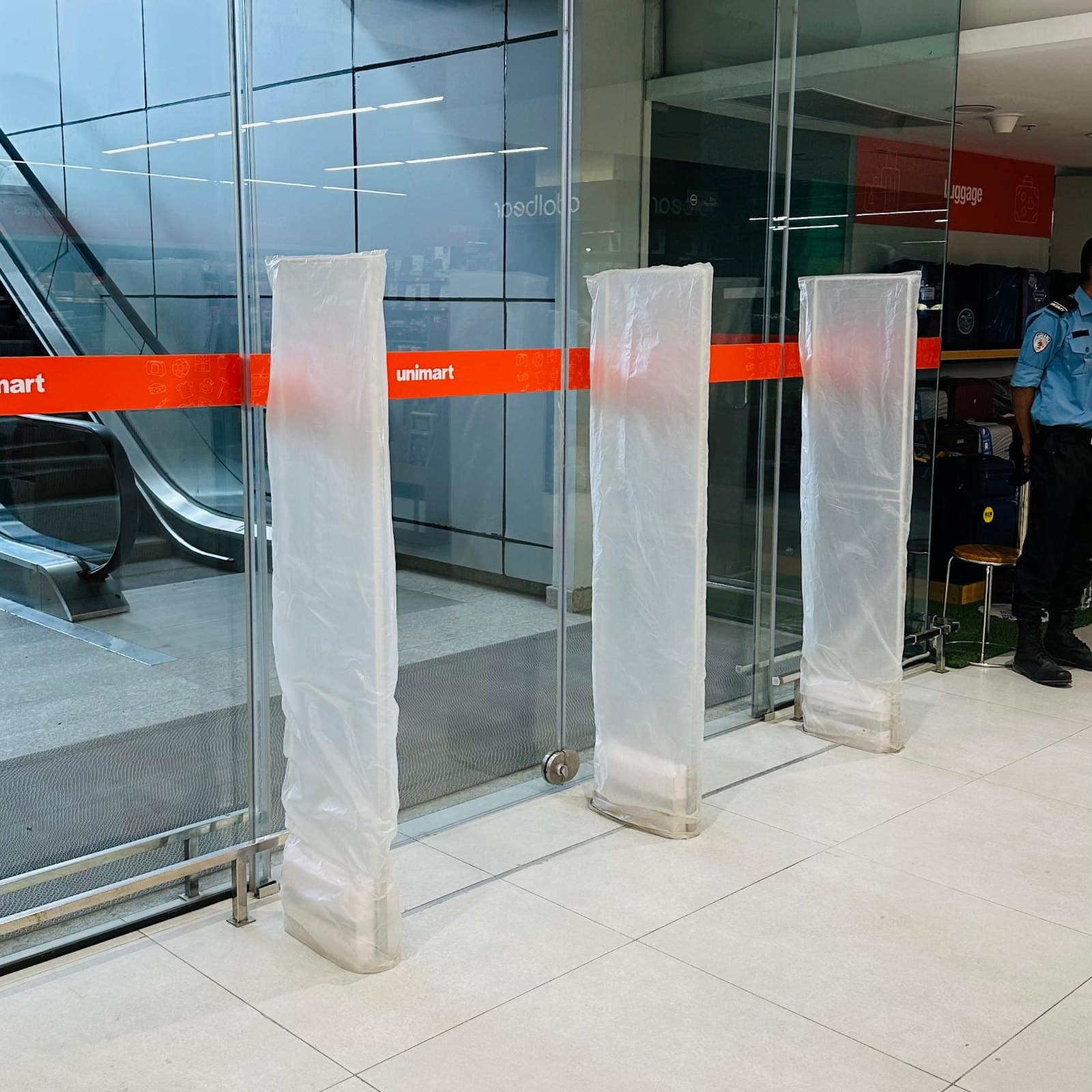 EAS pedestals, still in protective wrapping, installed at the entrance of Unimart, Airport Road, Dhaka